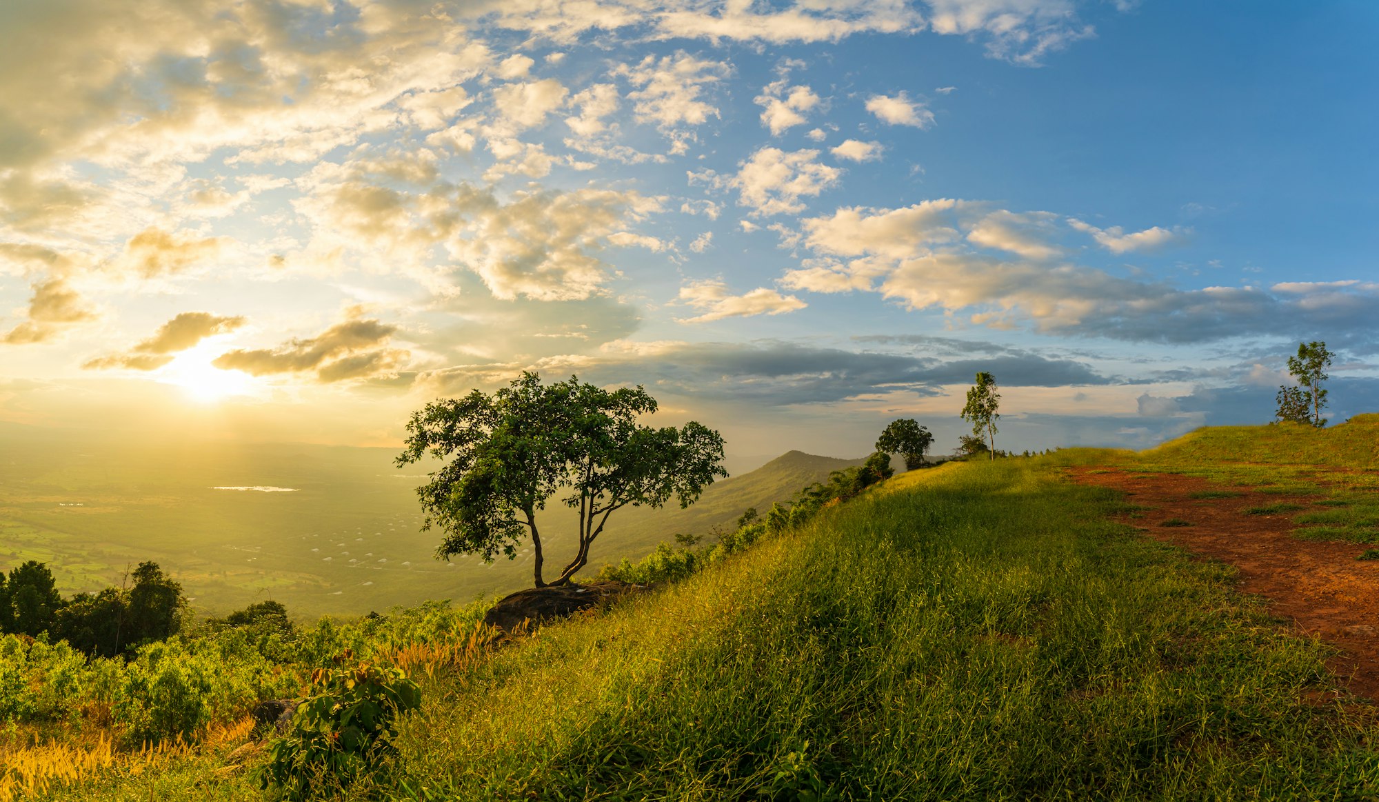 Mountain landscape with colorful vivid sunset on the cloudy sk